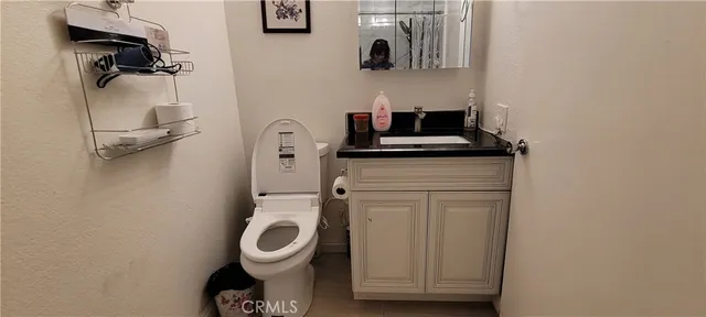 a bathroom with a toilet and a sink