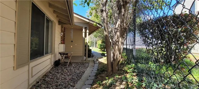 a view of a house with a backyard