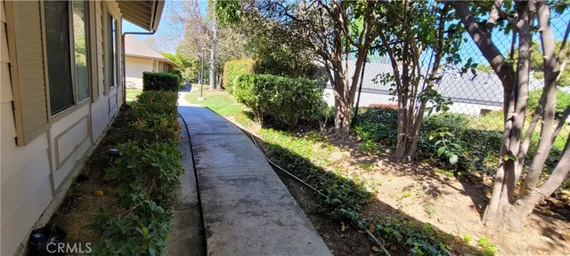 a view of a pathway with a yard