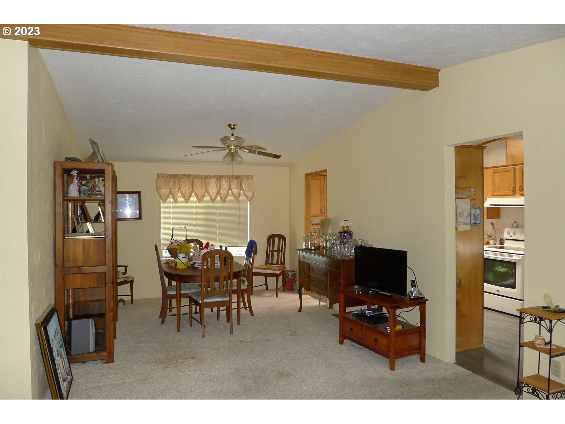 100 River Bend Road, Unit 117 Reedsport, OR 97467 - Photo 6 of 35 a living room with furniture and a flat screen tv