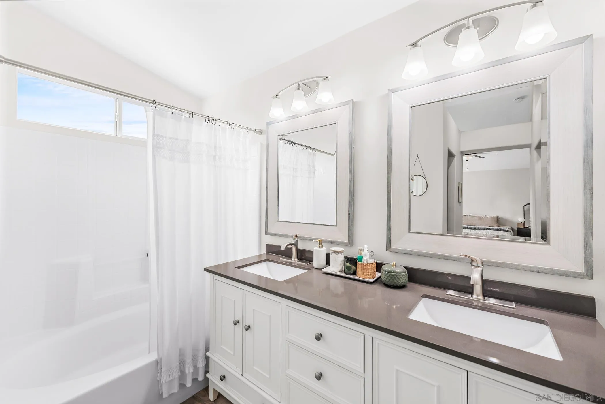 111 Wintercreek Place Santee, CA 92071 - Photo 23 of 53 a bathroom with double sink and a mirror