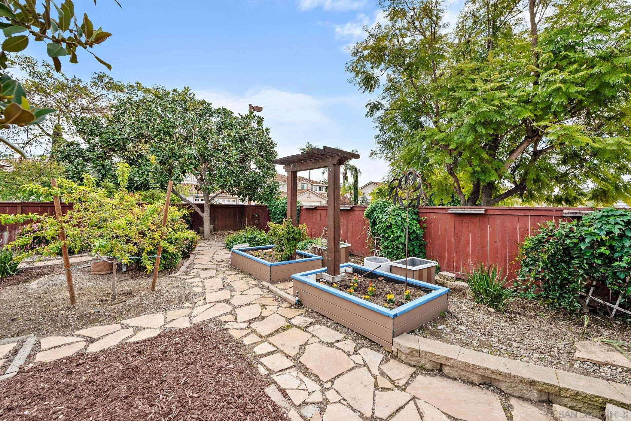 111 Wintercreek Place Santee, CA 92071 - Photo 34 of 53 a wooden bench sitting in front of a building