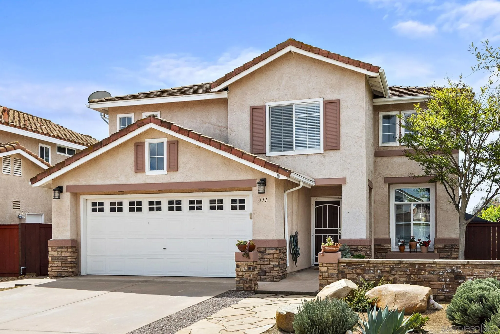 111 Wintercreek Place Santee, CA 92071 - Photo 5 of 53 a front view of a house with a yard