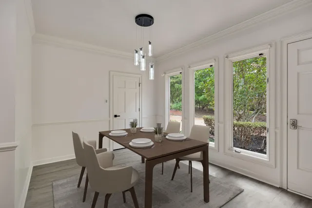 a view of a dining room with furniture window and outside view