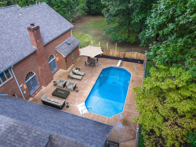 an aerial view of a house with outdoor space