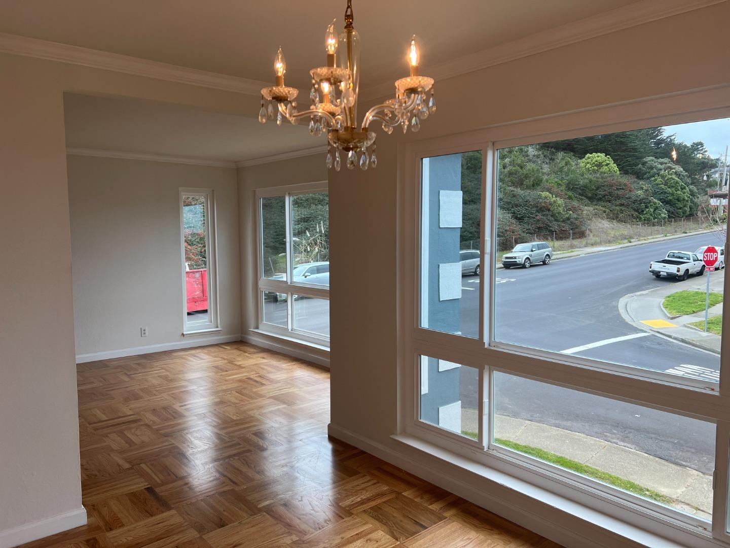 99 Castillejo Drive Daly City, CA 94015 - Photo 4 of 21 a view of a livingroom with wooden floor and chandelier