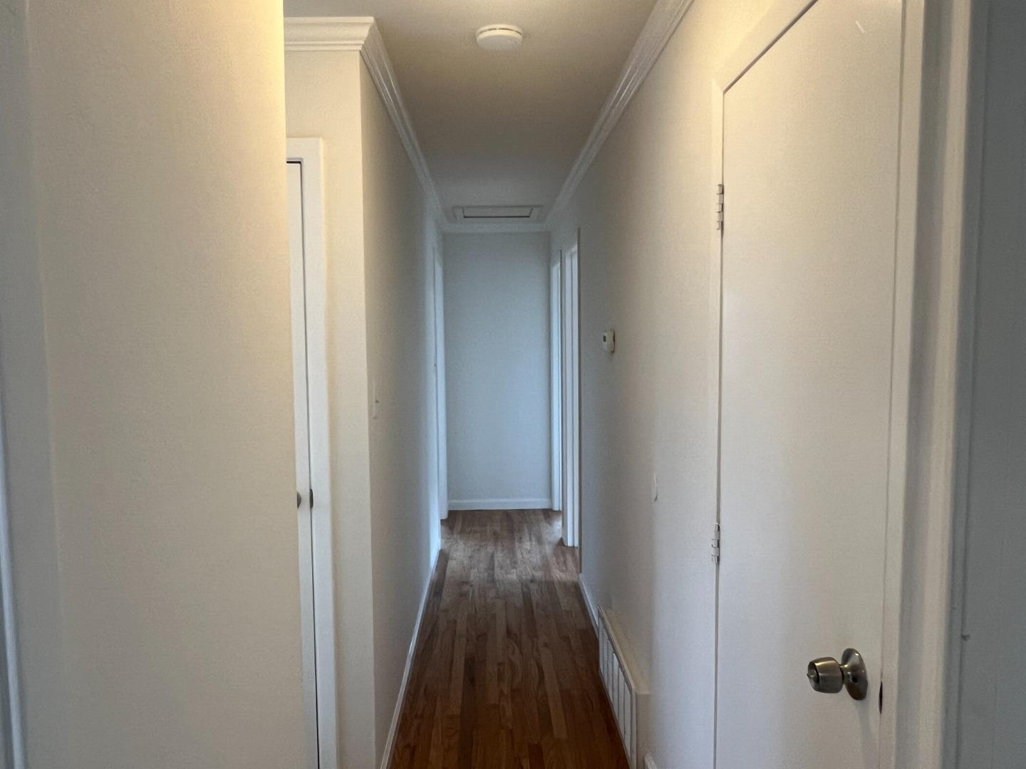 99 Castillejo Drive Daly City, CA 94015 - Photo 9 of 21 a view of a hallway with wooden floor