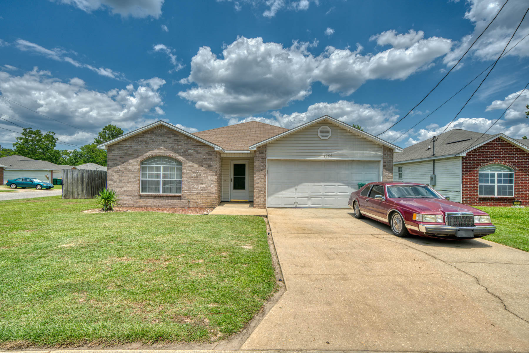1755 Old Ranch Road Fort Walton Beach, FL 32547 - Photo 2 of 35 a front view of a house with garden