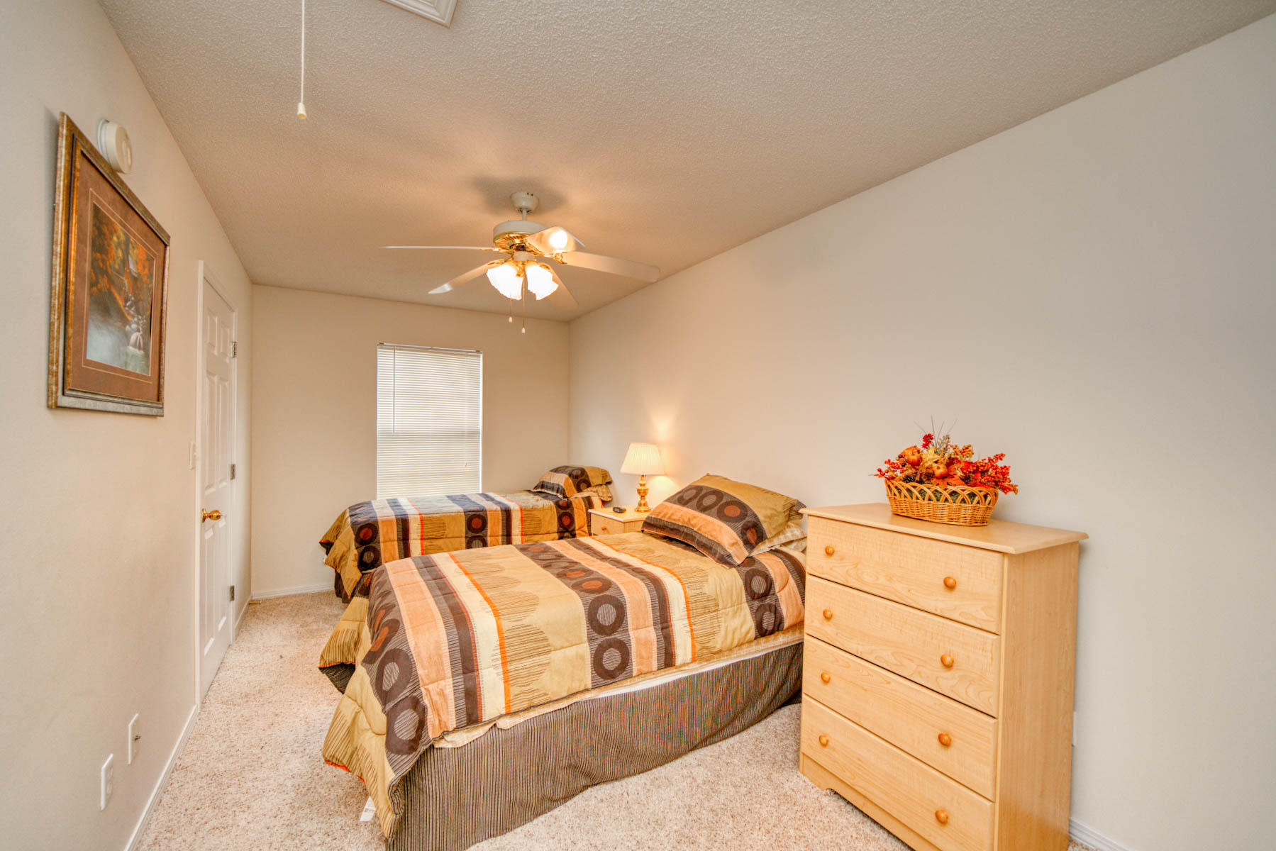 1755 Old Ranch Road Fort Walton Beach, FL 32547 - Photo 12 of 35 a bed room with a bed and a chandelier