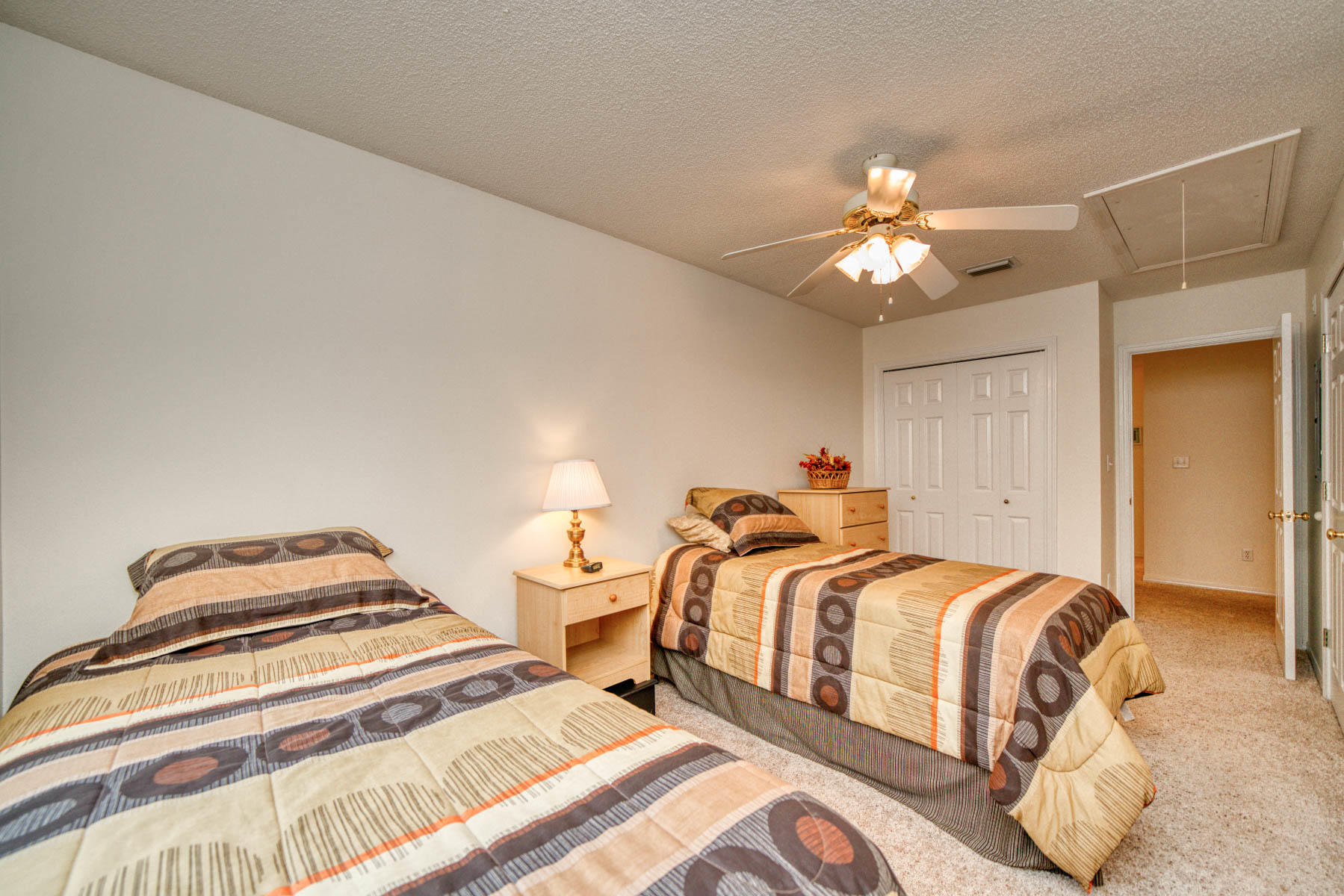 1755 Old Ranch Road Fort Walton Beach, FL 32547 - Photo 13 of 35 a bedroom with two beds and a chandelier