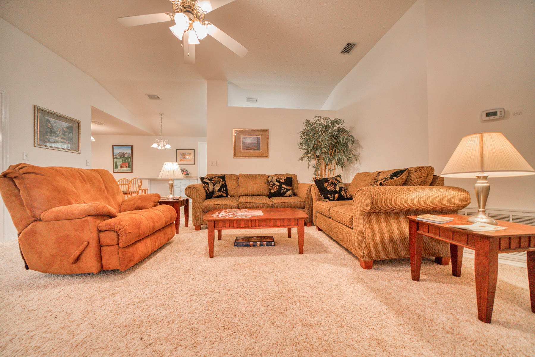 1755 Old Ranch Road Fort Walton Beach, FL 32547 - Photo 15 of 35 a living room with furniture a lamp and a chandelier