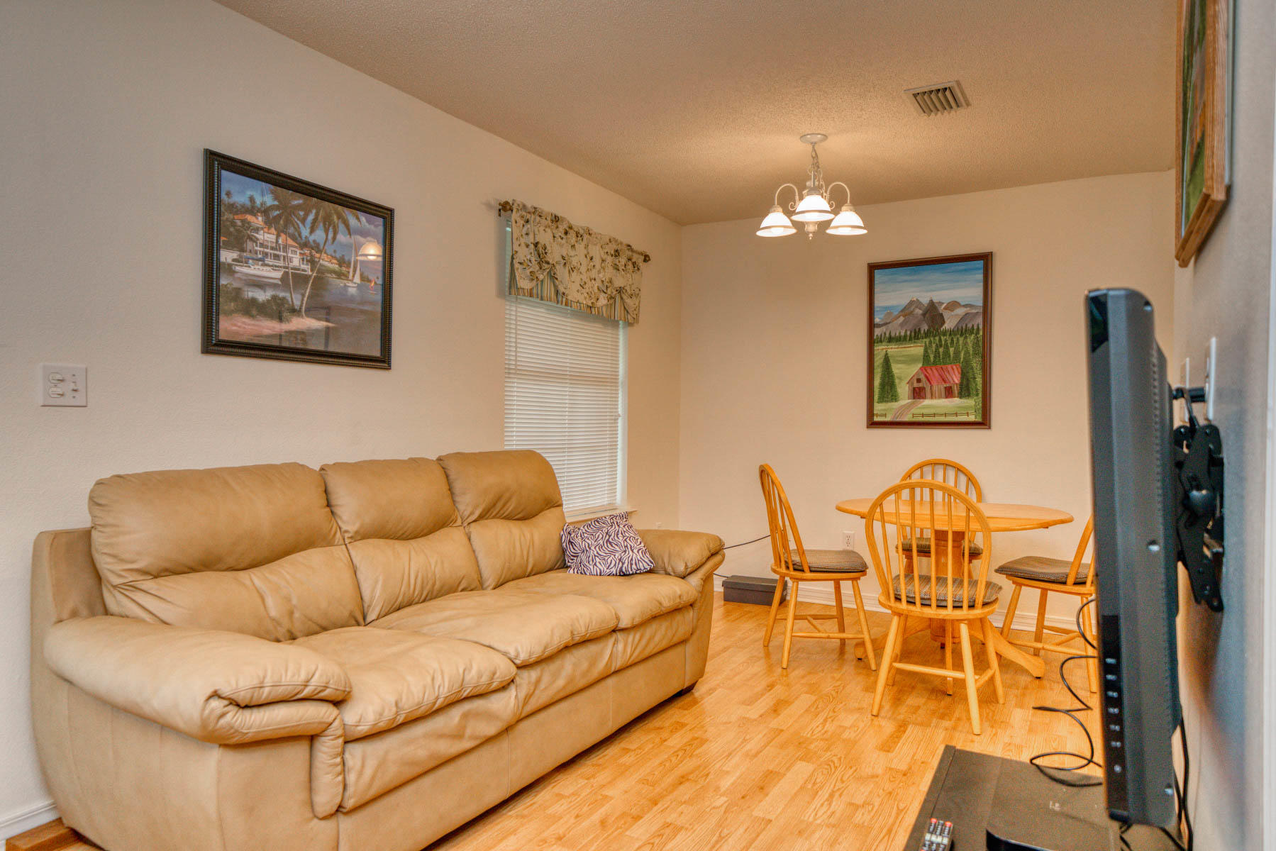 1755 Old Ranch Road Fort Walton Beach, FL 32547 - Photo 16 of 35 a living room with furniture a chandelier and a dining table