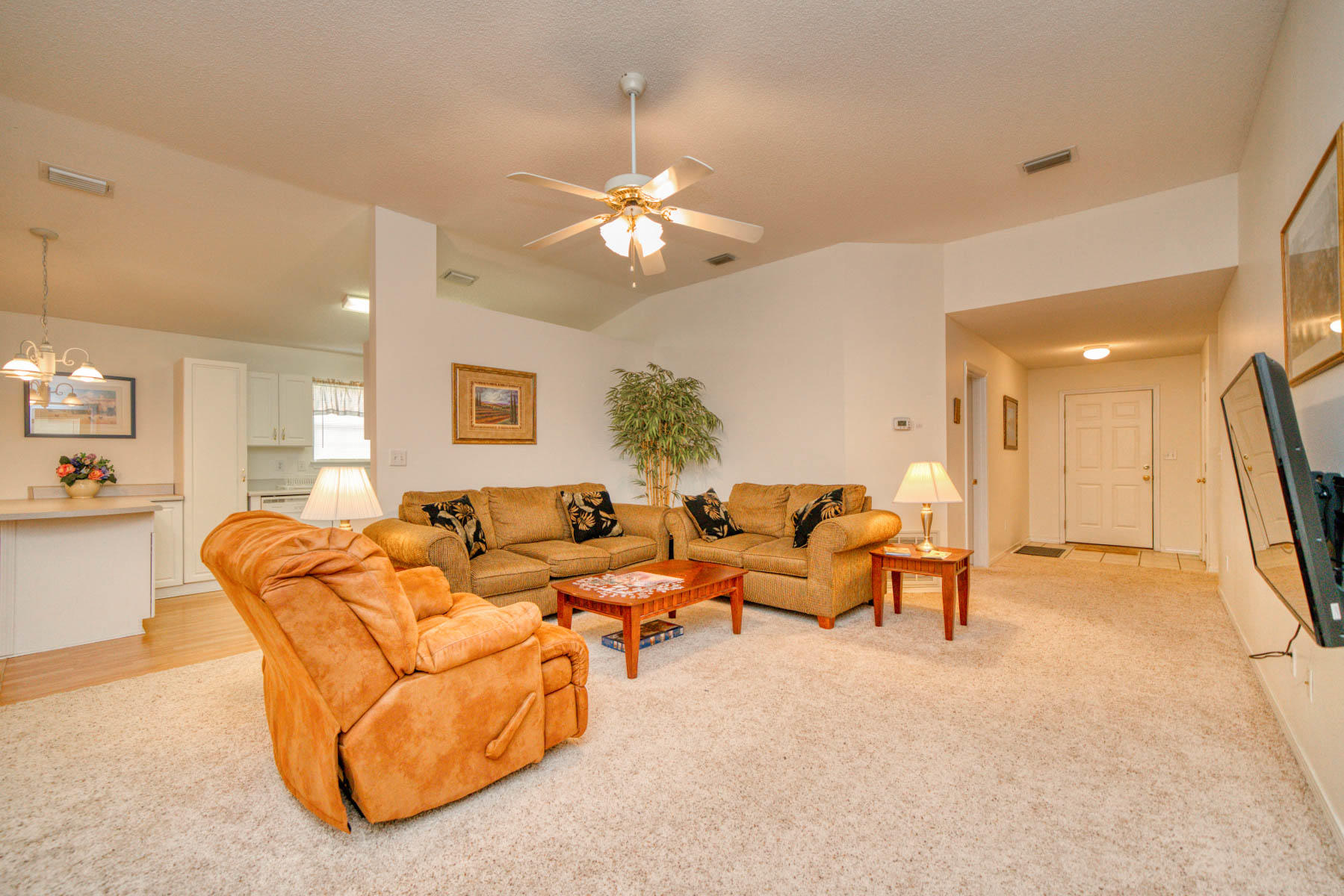 1755 Old Ranch Road Fort Walton Beach, FL 32547 - Photo 17 of 35 a living room with furniture a large window and a chandelier