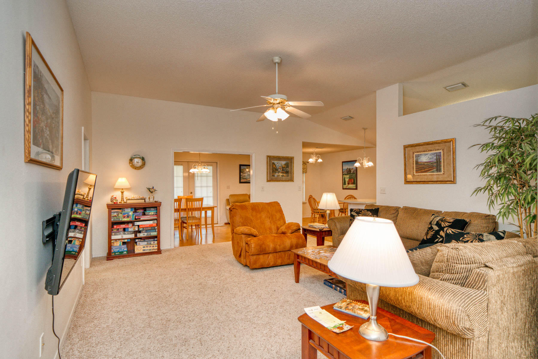 1755 Old Ranch Road Fort Walton Beach, FL 32547 - Photo 3 of 35 a living room with furniture a lamp and a flat screen tv
