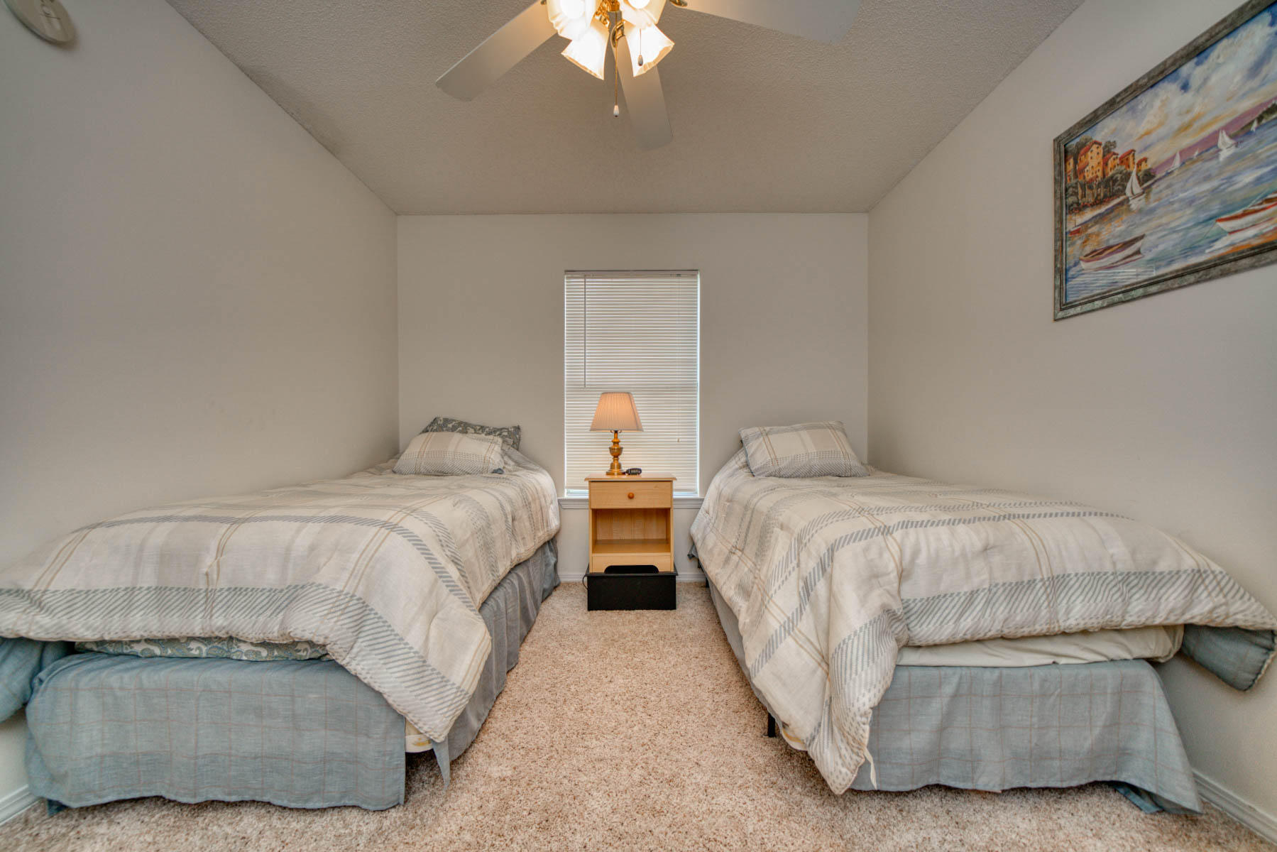 1755 Old Ranch Road Fort Walton Beach, FL 32547 - Photo 23 of 35 a bedroom with two beds and a chandelier