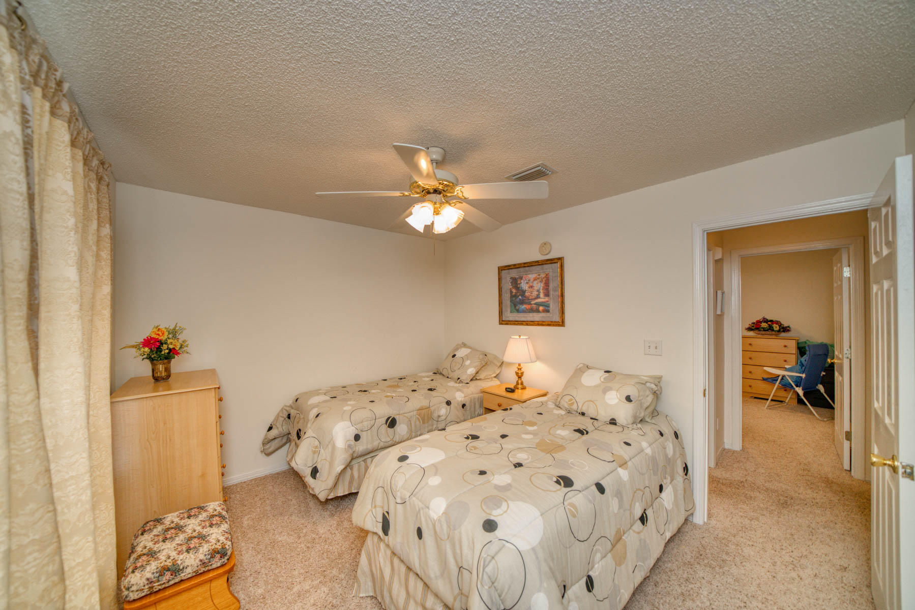 1755 Old Ranch Road Fort Walton Beach, FL 32547 - Photo 25 of 35 a bedroom with a bed and a chandelier