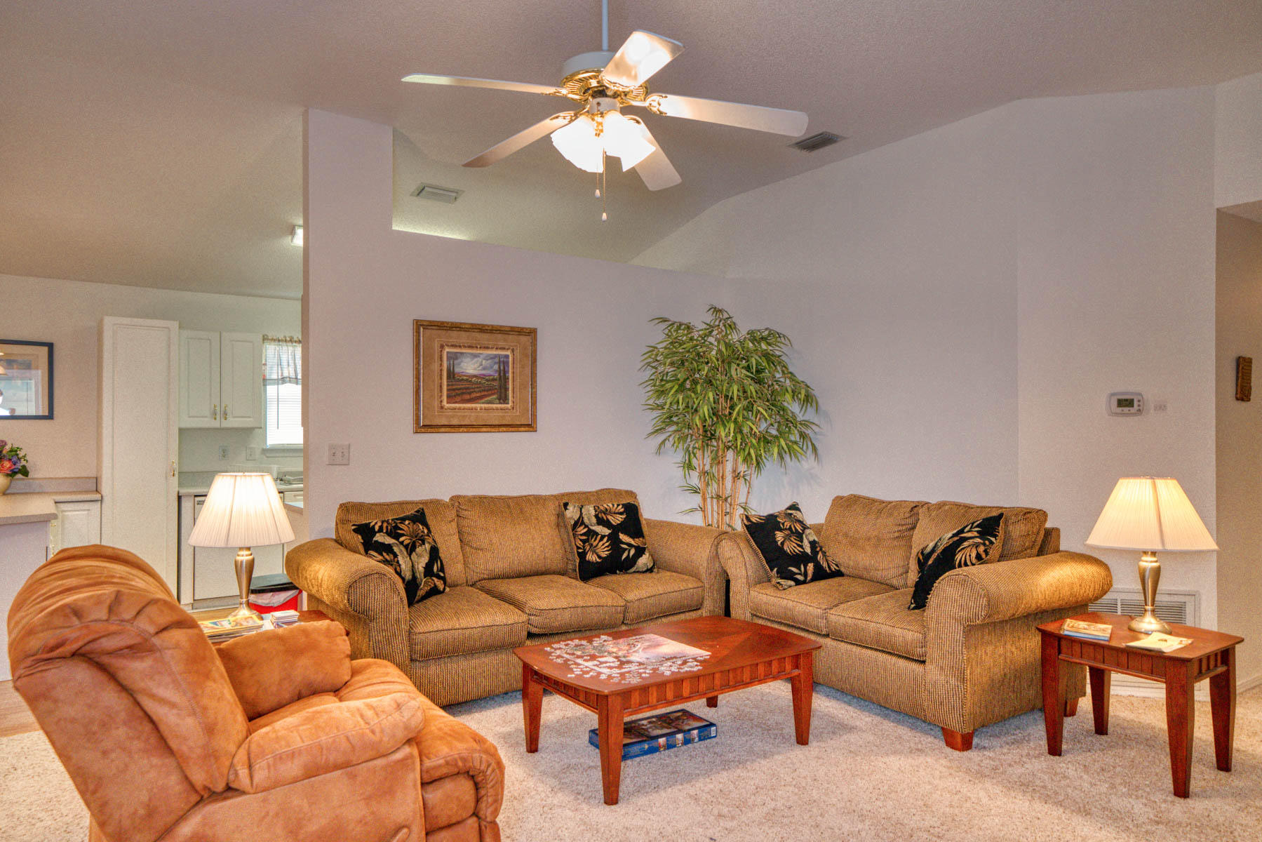 1755 Old Ranch Road Fort Walton Beach, FL 32547 - Photo 4 of 35 a living room with furniture a chandelier and a potted plant
