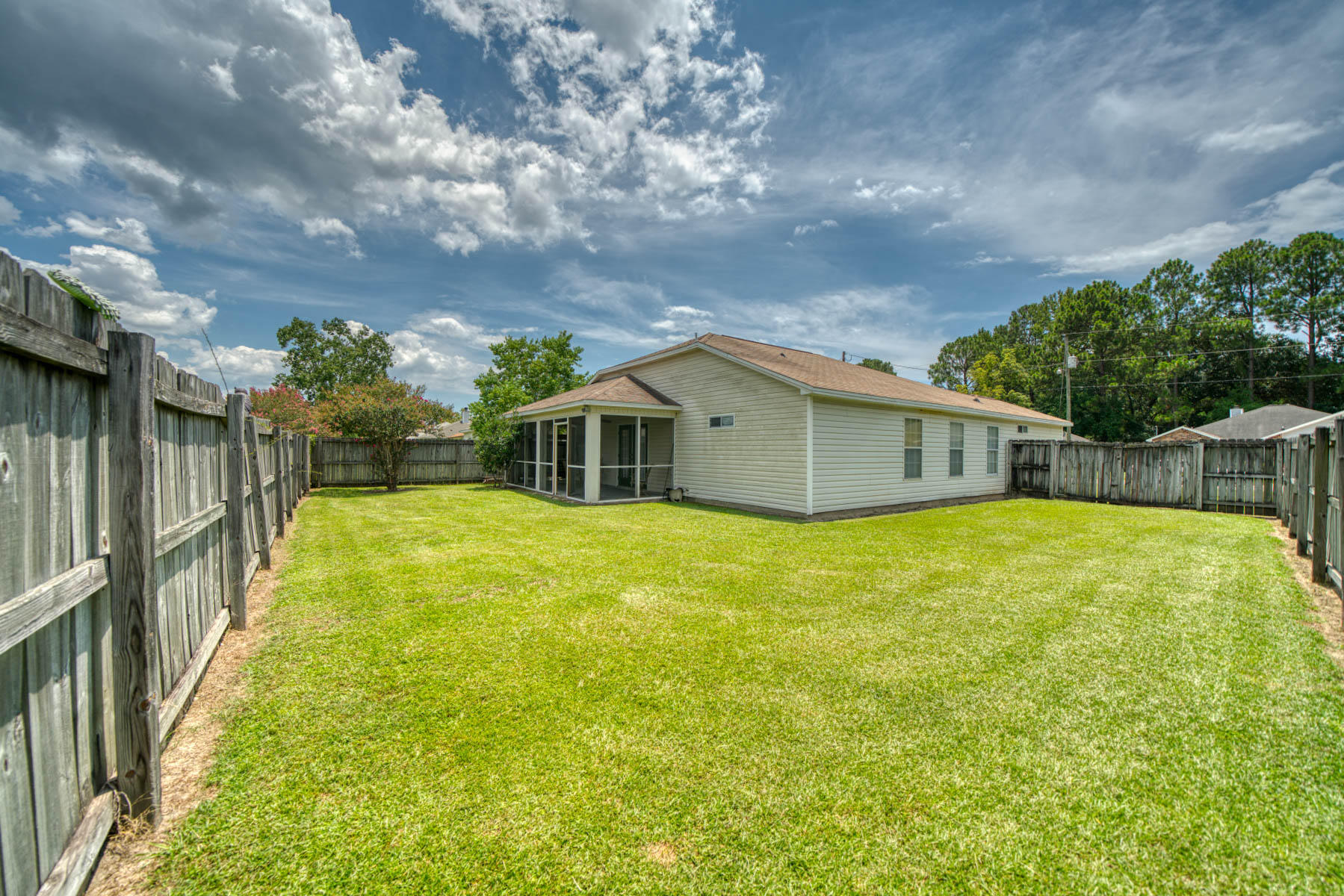 1755 Old Ranch Road Fort Walton Beach, FL 32547 - Photo 31 of 35 a yellow house with swimming pool in front of it