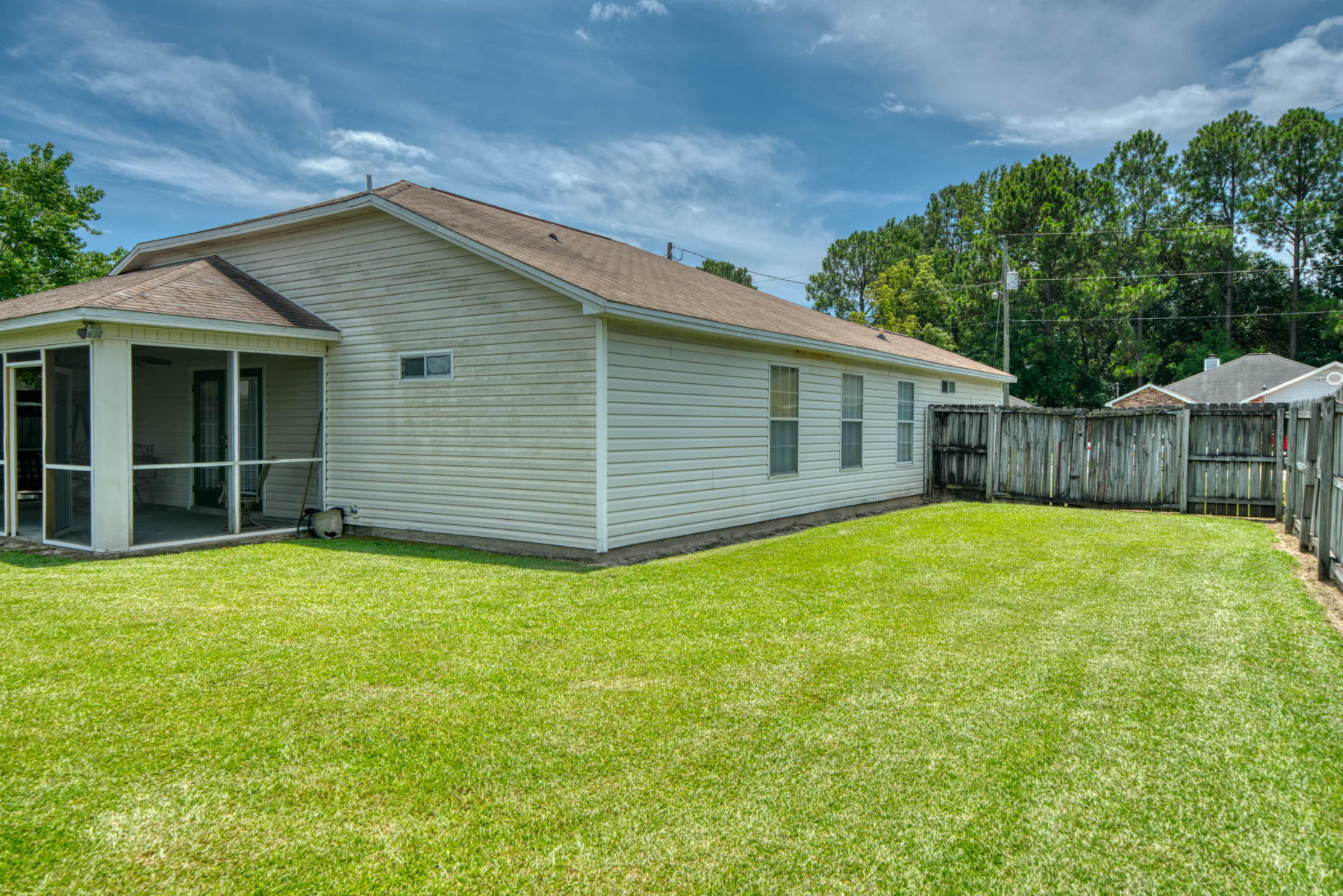 1755 Old Ranch Road Fort Walton Beach, FL 32547 - Photo 32 of 35 a backyard of a house with table and chairs