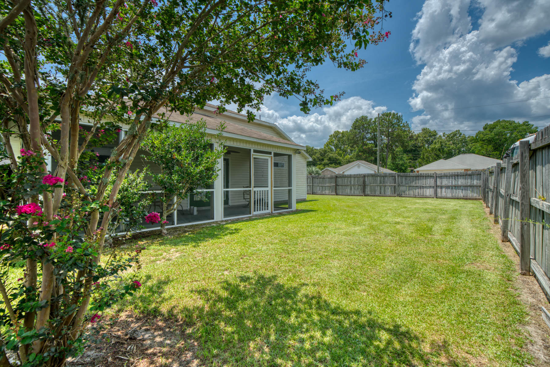 1755 Old Ranch Road Fort Walton Beach, FL 32547 - Photo 33 of 35 a view of an house with backyard space and balcony