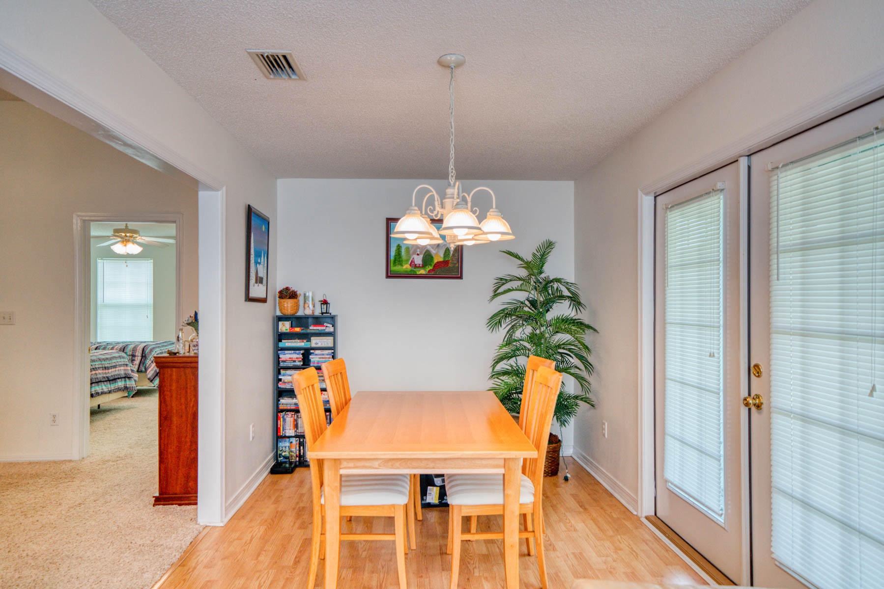 1755 Old Ranch Road Fort Walton Beach, FL 32547 - Photo 5 of 35 a dining room filled chandelier and wooden floor