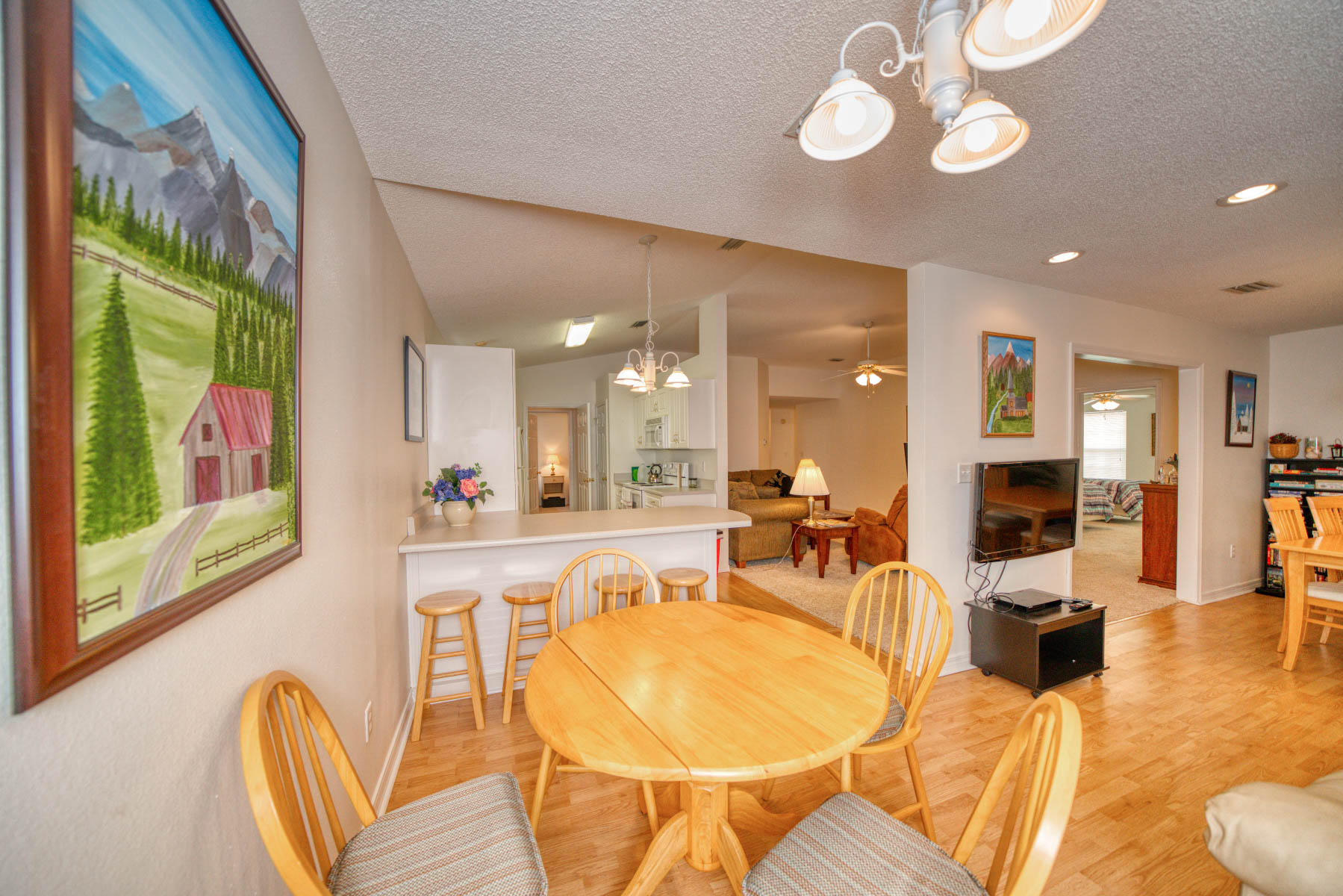 1755 Old Ranch Road Fort Walton Beach, FL 32547 - Photo 6 of 35 a very nice looking dining room with furniture a chandelier and kitchen view
