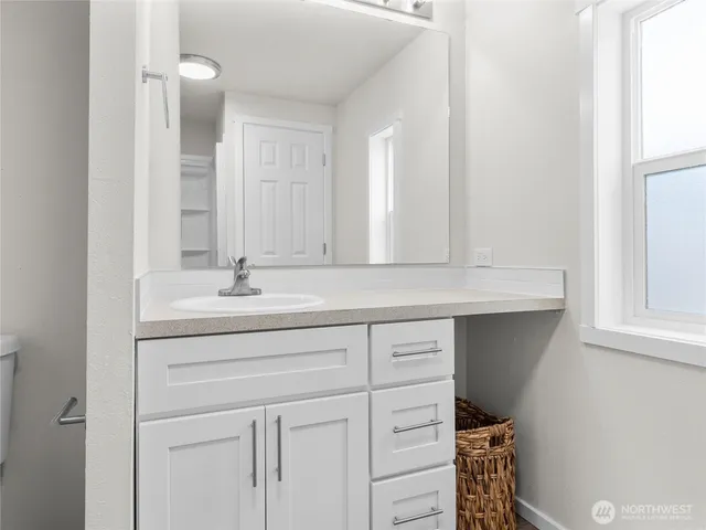 a bathroom with a sink and a mirror