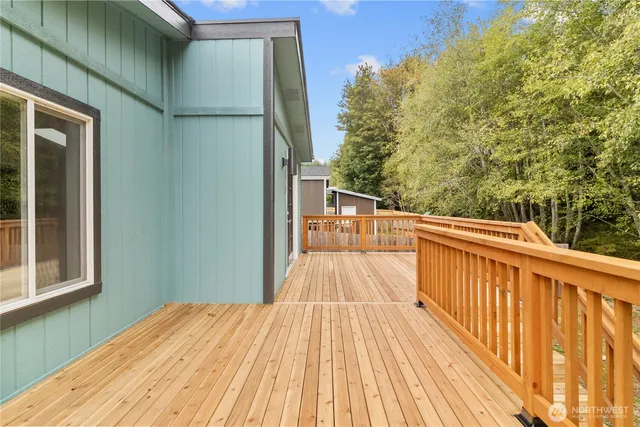 a front view of a house with wooden fence