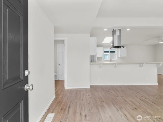 a view of a kitchen from the hallway