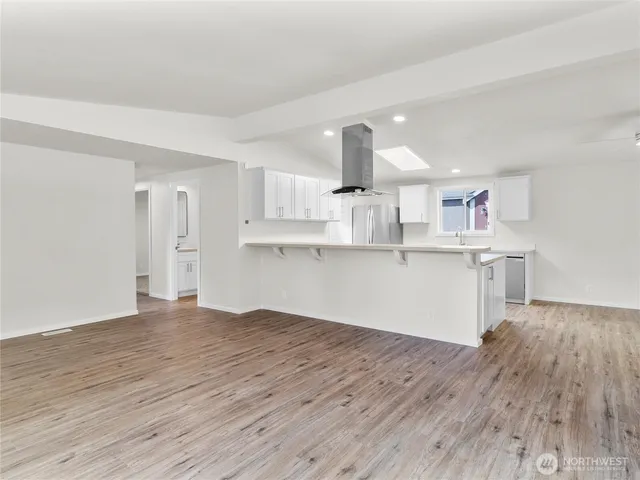 a view of kitchen with wooden floor and window