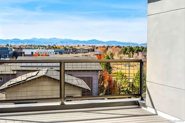 a view of balcony with outdoor seating and city view