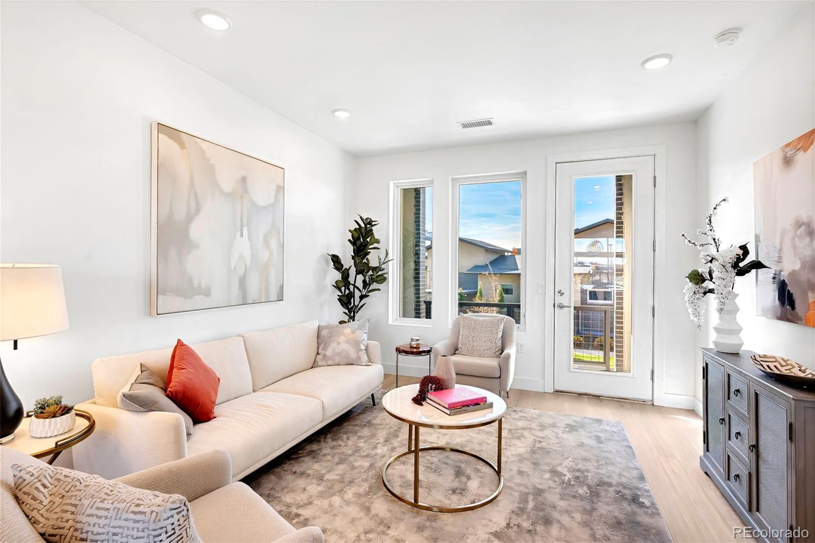 22 Oneida Court Denver, CO 80230 - Photo 30 of 44 a living room with furniture and a potted plant