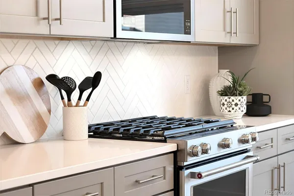 a kitchen with a stove and cabinets