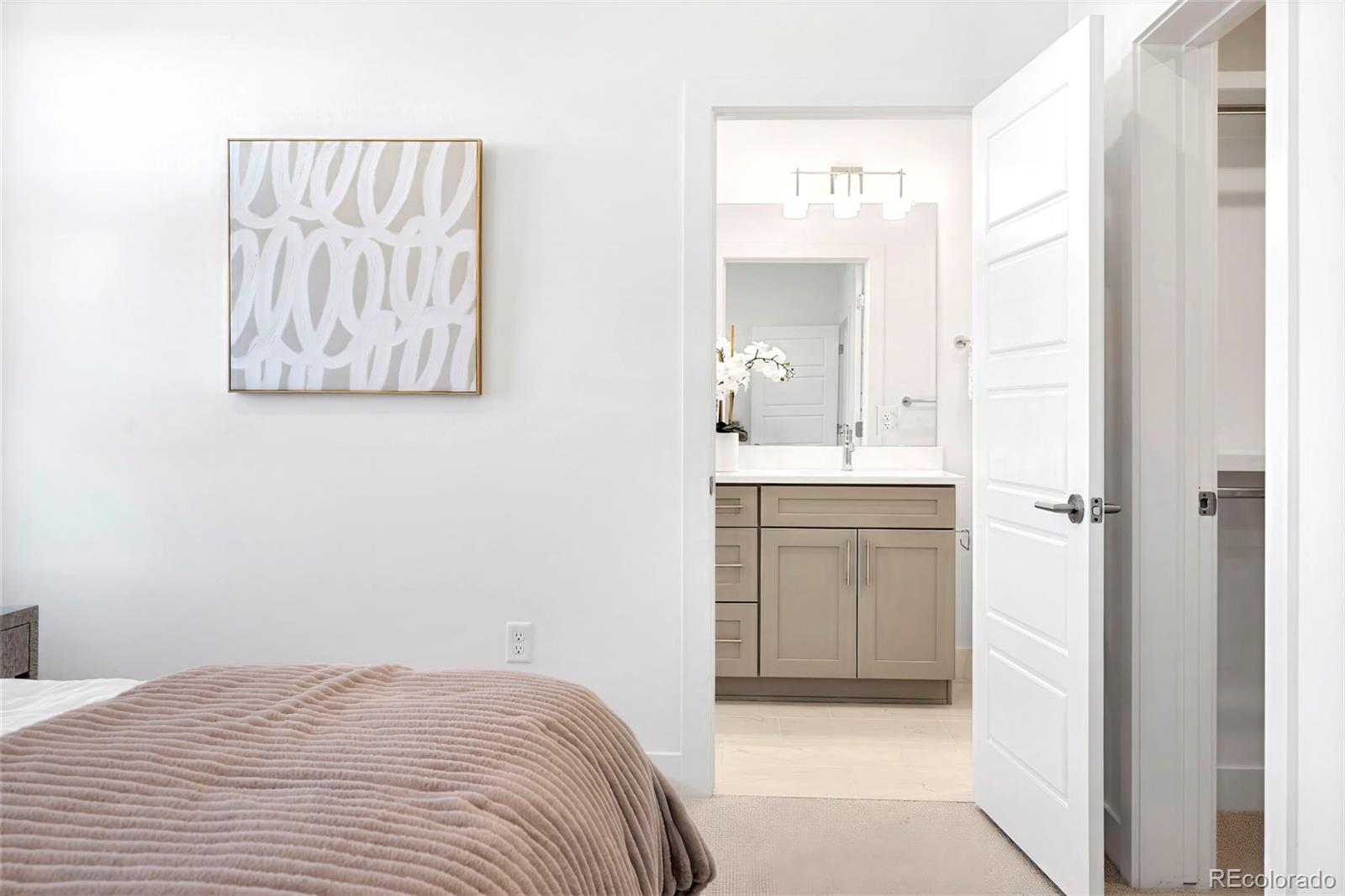 22 Oneida Court Denver, CO 80230 - Photo 34 of 44 a bathroom with a sink and a mirror