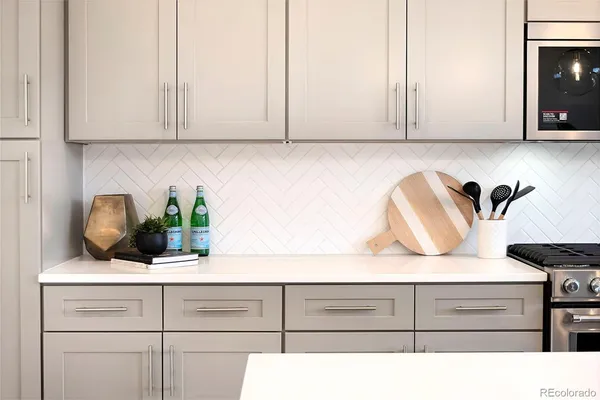 a kitchen with appliances cabinets and a counter top space