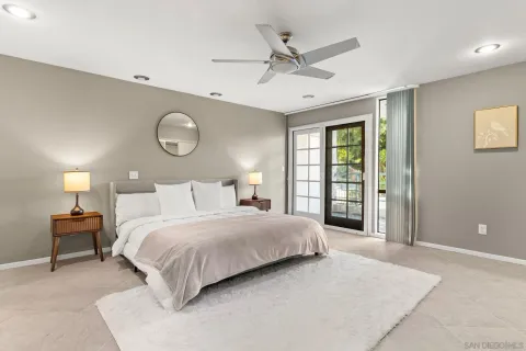 a bathroom with a sink mirror and a shower