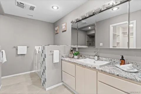 a bathroom with a shower toilet and sink