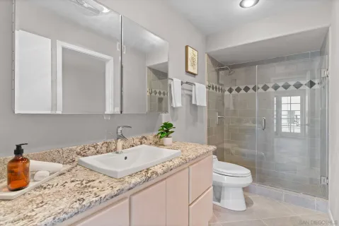 a dining room with furniture and a window