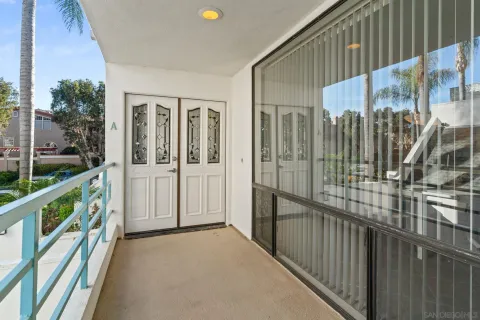 a view of a balcony with chairs