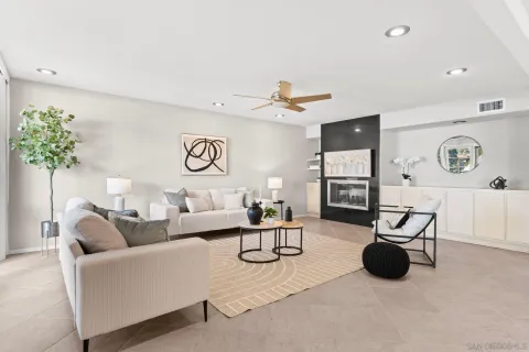 a living room with furniture and a large window