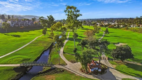 a view of a golf course with a lake