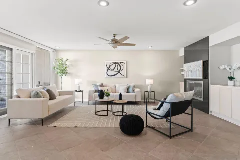 a living room with furniture and a large window