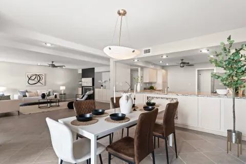a dining room with furniture and window