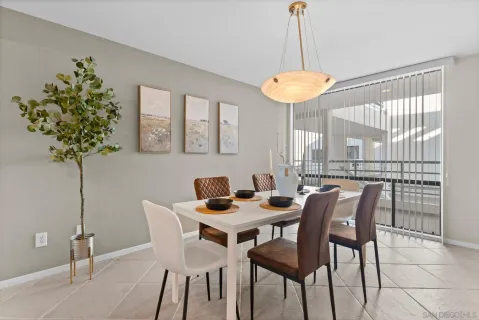 a view of a dining room with a table and chairs