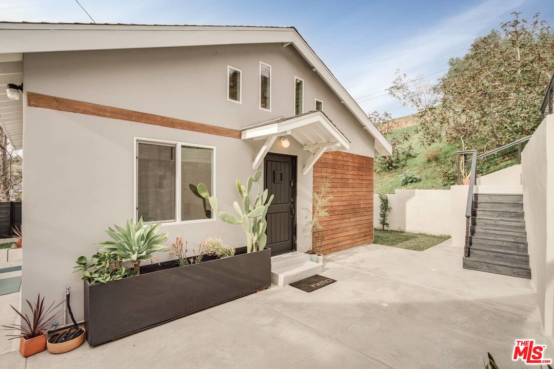 4535 Dudley Drive Los Angeles, CA 90032 - Photo 1 of 24 a front view of a house with a yard