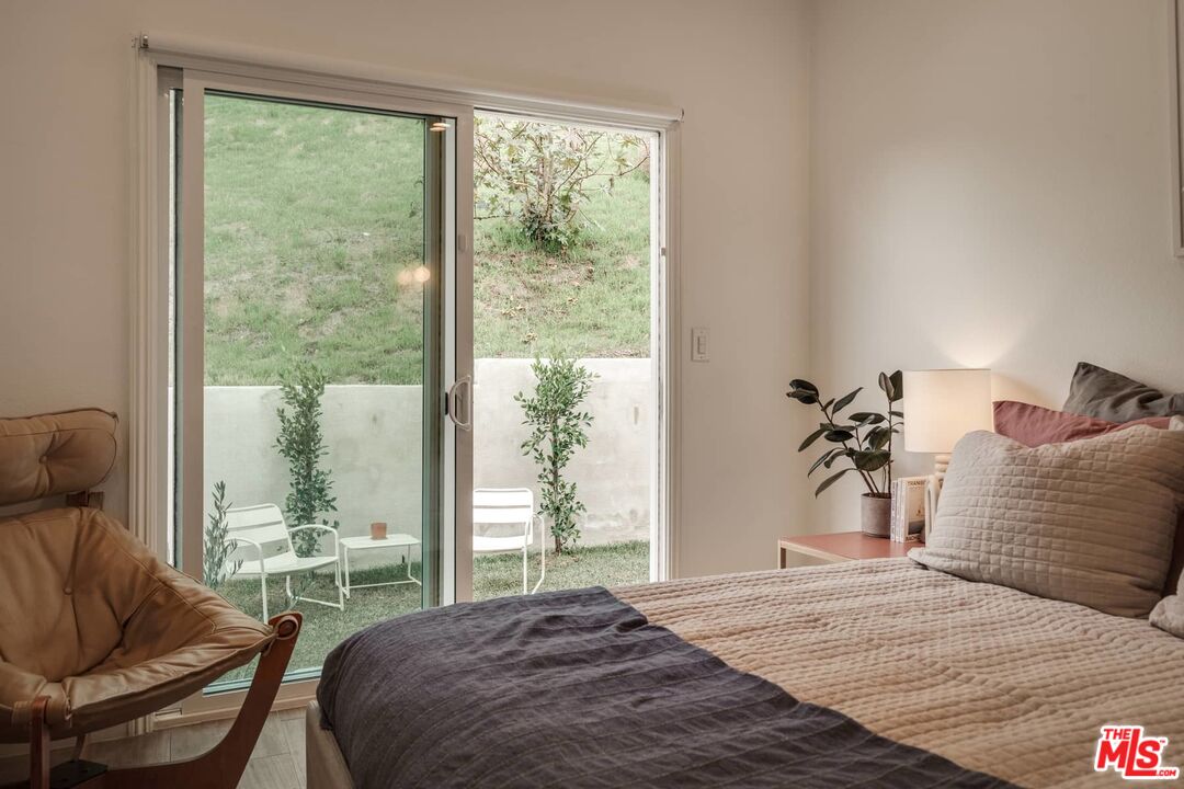 4535 Dudley Drive Los Angeles, CA 90032 - Photo 14 of 24 a bedroom with a large bed and a large window