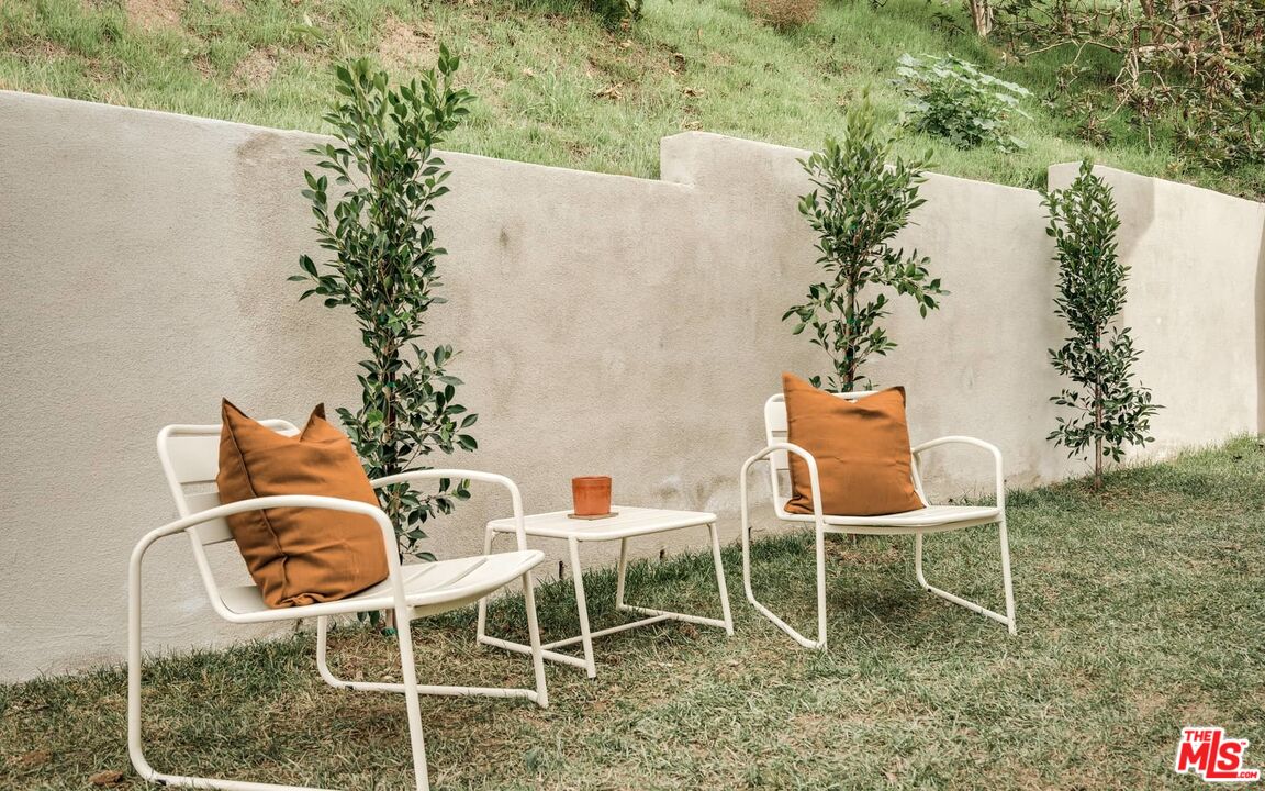 4535 Dudley Drive Los Angeles, CA 90032 - Photo 18 of 24 a table and chairs in a garden