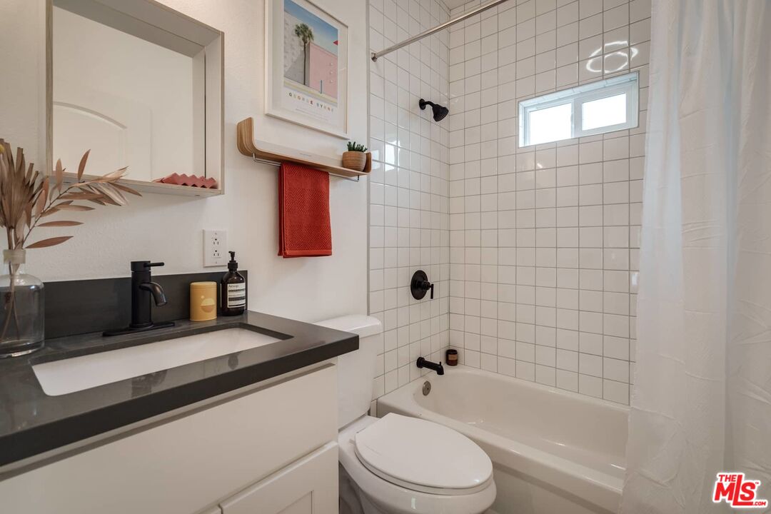 4535 Dudley Drive Los Angeles, CA 90032 - Photo 8 of 24 a bathroom with a sink a toilet and bathtub