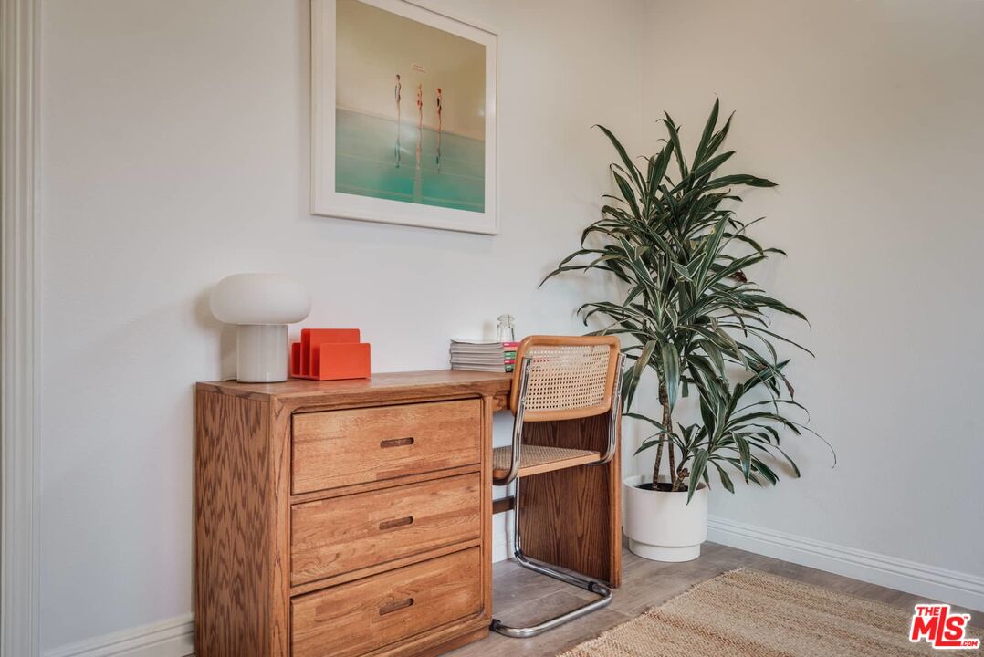 4535 Dudley Drive Los Angeles, CA 90032 - Photo 10 of 24 a table with potted plant and a potted plant