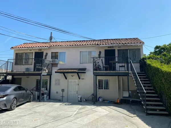 a front view of a house with stairs